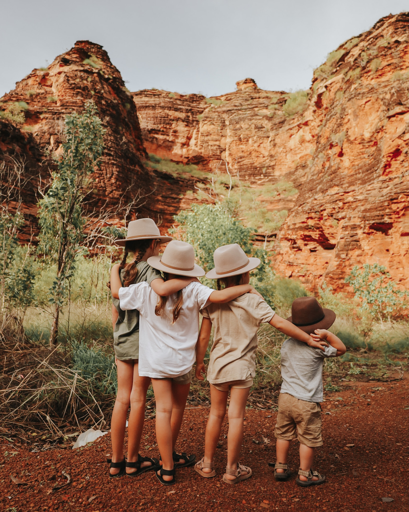 Four children looking out at the Australian Kimberley landscape, exemplifying a breathtaking location choice for family vacations.